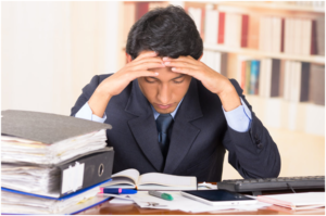 boy feeling headache in office